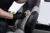 Man car wash worker cleaning leather boat seat with brush