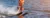 Woman riding water skis closeup. Body parts without a face. Athlete water skiing and having fun. Living a healthy lifestyle and staying active. Water sports theme. Summer by the sea. Banner for website
